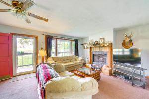 a living room with two couches and a fireplace at 5 Mi to Lake Junaluska Mtn Haven with Deck! in Waynesville