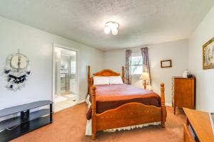 a bedroom with a bed and a television in a room at 5 Mi to Lake Junaluska Mtn Haven with Deck! in Waynesville