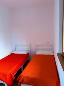 Postel nebo postele na pokoji v ubytování Appartamento tiziano