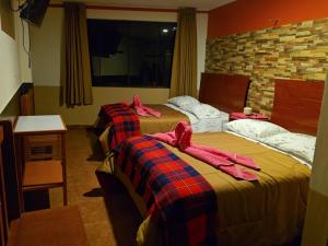 Postel nebo postele na pokoji v ubytování Hotel Manantial