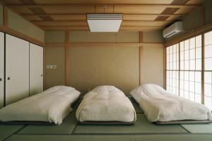 Uma cama ou camas num quarto em 赤城宿 珠蕾山荘-shurai-
