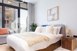 Ένα ή περισσότερα κρεβάτια σε δωμάτιο στο Bloomfields Hidden Gem Stu Al Maryah Vista +32 φωτογραφίες