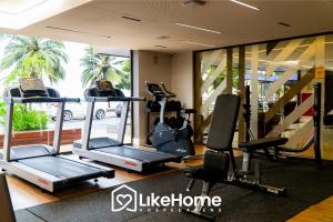 a gym with treadmills and elliptical machines at Unity Cabo Branco - LikeHome Hospedagens in João Pessoa