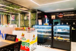 a bakery with a display case filled with pastries at Unity Cabo Branco - LikeHome Hospedagens in João Pessoa +30 photos