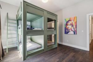 a green room with bunk beds in it at Country Music Themed Goodrich Ave by SkyRun Nashville in Nashville +74 photos