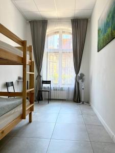 Postel nebo postele na pokoji v ubytování Golden Hostel