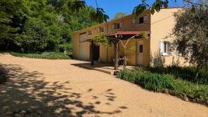 a house with a bike parked in front of it at Terres du Milieu in Saint-Mayme-de-Pereyol +39 photos