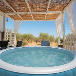 una grande piscina nel mezzo di un patio di Boho Sisi Resort - Poolside Oasis & Garden Vibes ad Ágios Nikólaos