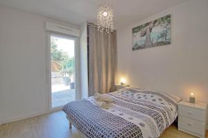 Postel nebo postele na pokoji v ubytování T3 Douillet avec grande terrasse