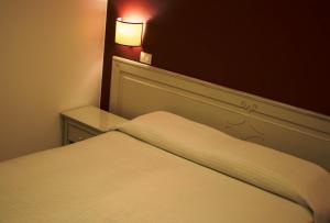 Postel nebo postele na pokoji v ubytování Parkhotel Montigeto