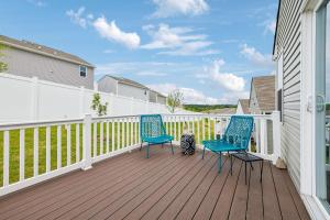two blue chairs sitting on a wooden deck at Stylish Vibe 2 Bed 2 Bath Nashville Home 30 or more Days by SkyRun Nashville in Nashville