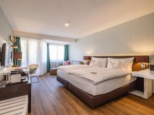 Ένα ή περισσότερα κρεβάτια σε δωμάτιο στο Hotel Spalentor - Ihr sympathisches Stadthotel