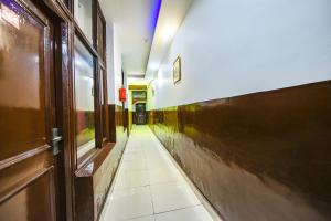 a hallway of a building with a door and a hallwayngth at FabExpress Diamond Sec 45 in Chandīgarh