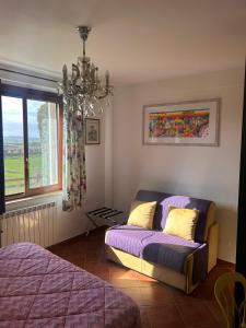 A bed or beds in a room at Casa Paola nel Chianti