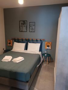 Postel nebo postele na pokoji v ubytování AEGEAN SUITES
