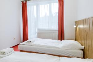 Postel nebo postele na pokoji v ubytování Hotel Tatrawest