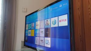 a television screen with a bunch of icons on it at Chalet Apartment Monêtier in Le Monêtier-les-Bains