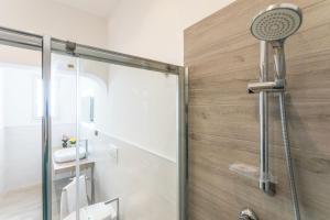 a bathroom with a shower with a glass door at Villa Mirella - Salento Reservation in Racale +81 photos