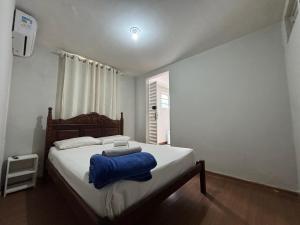 Cama ou camas em um quarto em Wafeh Pampulha Suítes