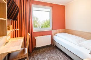 Postel nebo postele na pokoji v ubytování Hotel Rennschuh