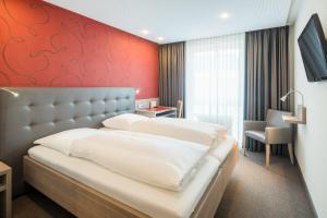 Postel nebo postele na pokoji v ubytování Hotel Rennschuh