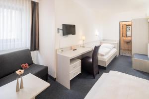 Postel nebo postele na pokoji v ubytování Hotel Rennschuh