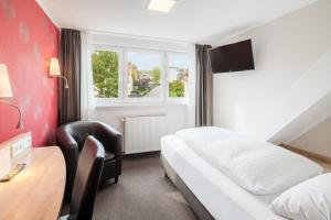 Postel nebo postele na pokoji v ubytování Hotel Rennschuh