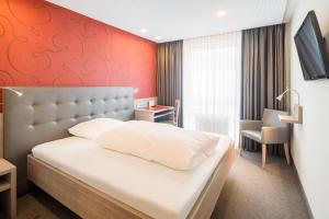 Postel nebo postele na pokoji v ubytování Hotel Rennschuh + 32 fotografií