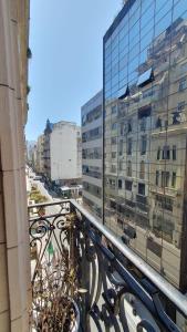 a balcony with a view of a building at Hostal 2 in Buenos Aires
