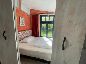 Postel nebo postele na pokoji v ubytování Ferienwohnung Teehaus