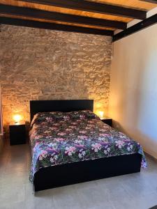 Postel nebo postele na pokoji v ubytování Vigna di pettineo - guest house