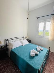 Postel nebo postele na pokoji v ubytování Mani Spot Nezoulas