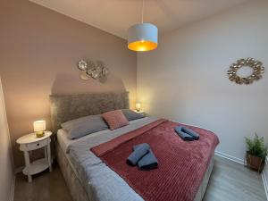 Postel nebo postele na pokoji v ubytování Apartmány U Kostela