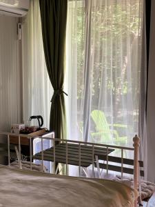 Postel nebo postele na pokoji v ubytování Frutak Resort-TINY HOMES