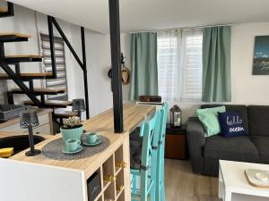a small living room with a table and a couch at Splav Casa Luna in Ostružnica