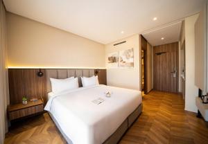 Ένα ή περισσότερα κρεβάτια σε δωμάτιο στο Citadines Almaz Aparthotel Casablanca