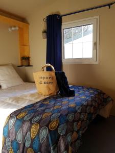 Ένα ή περισσότερα κρεβάτια σε δωμάτιο στο Camping Hello Soleil