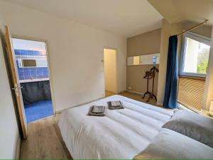 Postel nebo postele na pokoji v ubytování La Rognouse - Maison vue mer