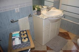 a bathroom with a sink and a toilet and a mirror at Casa Rural Almocaizar B&B in Los Gallardos +32 photos