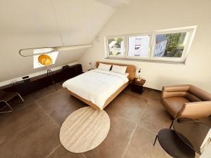 Postel nebo postele na pokoji v ubytování Abstatt Deluxe Loft with Spa + 21 fotografií