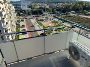 a balcony with a view of a parking lot at Milan Luxury Apartaments X in Târgu-Mureş