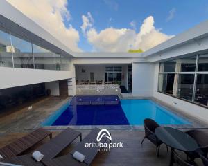 a swimming pool in the middle of a house at Arituba Park Hotel in Natal