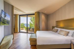 Postel nebo postele na pokoji v ubytování Il Boscareto Resort & Spa + 37 fotografií