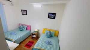Postel nebo postele na pokoji v ubytování Dhanmondi Lake View Hotel