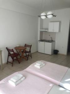 A kitchen or kitchenette at Amalia Hotel
