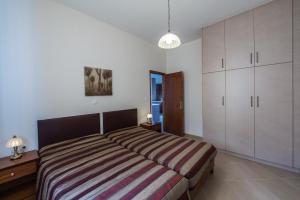 Posteľ alebo postele v izbe v ubytovaní Lila Villas