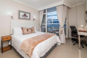 Ένα ή περισσότερα κρεβάτια σε δωμάτιο στο Heart of CapeTown City Studio - Within 5mins walk to V&A or CTICC
