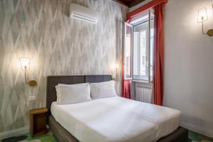 Posteľ alebo postele v izbe v ubytovaní 19 Steps Trevi
