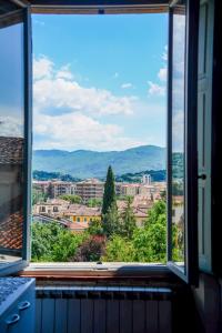 a large window with a view of a city at Appartamento Santa Croce in Arezzo