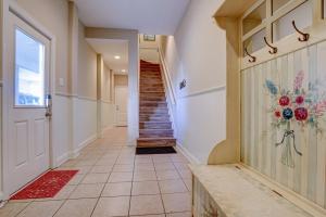 a hallway of a home with a staircase and a door at Sea Star Village 320 in West Onslow Beach